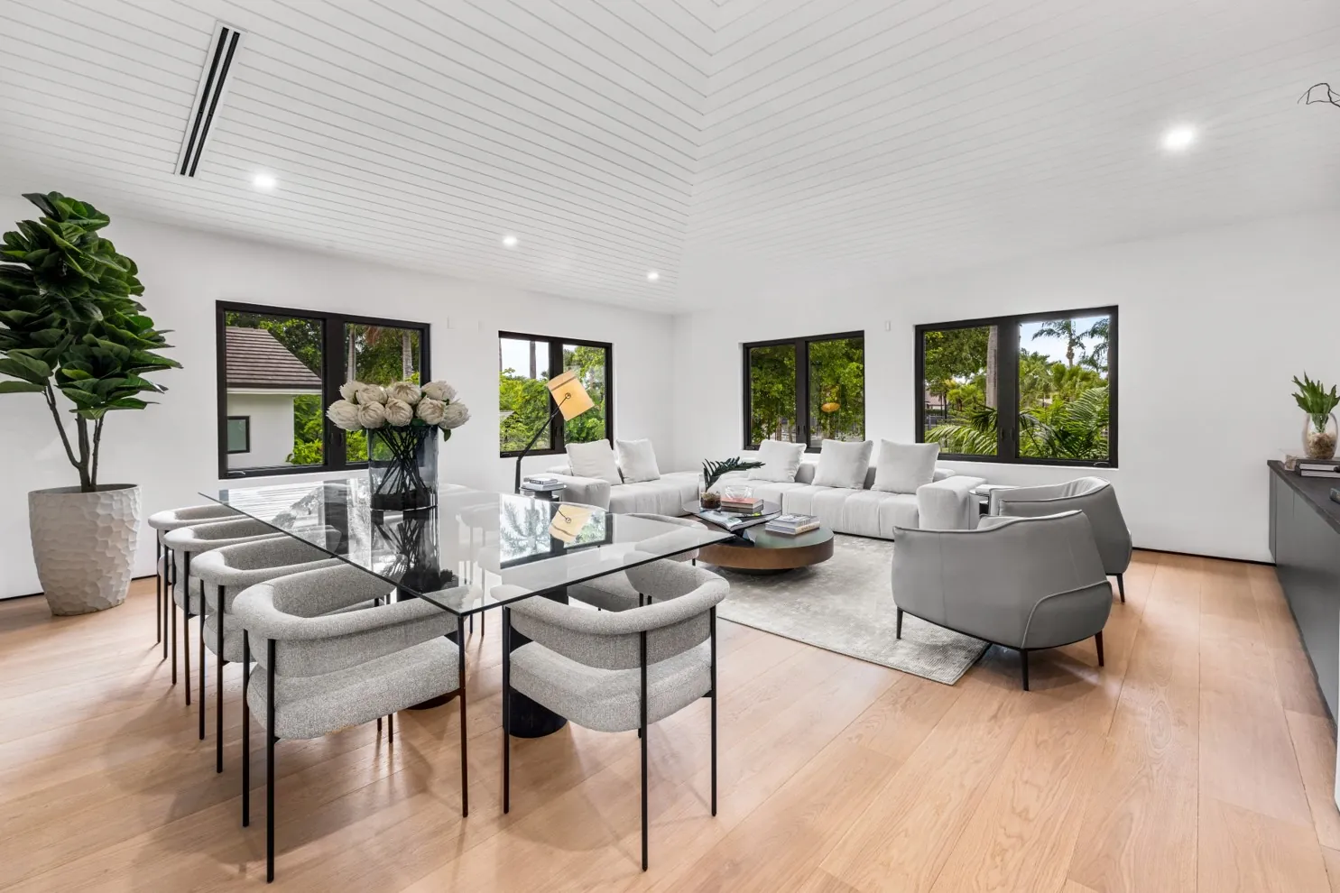 Light oak floor in an open living and dining room