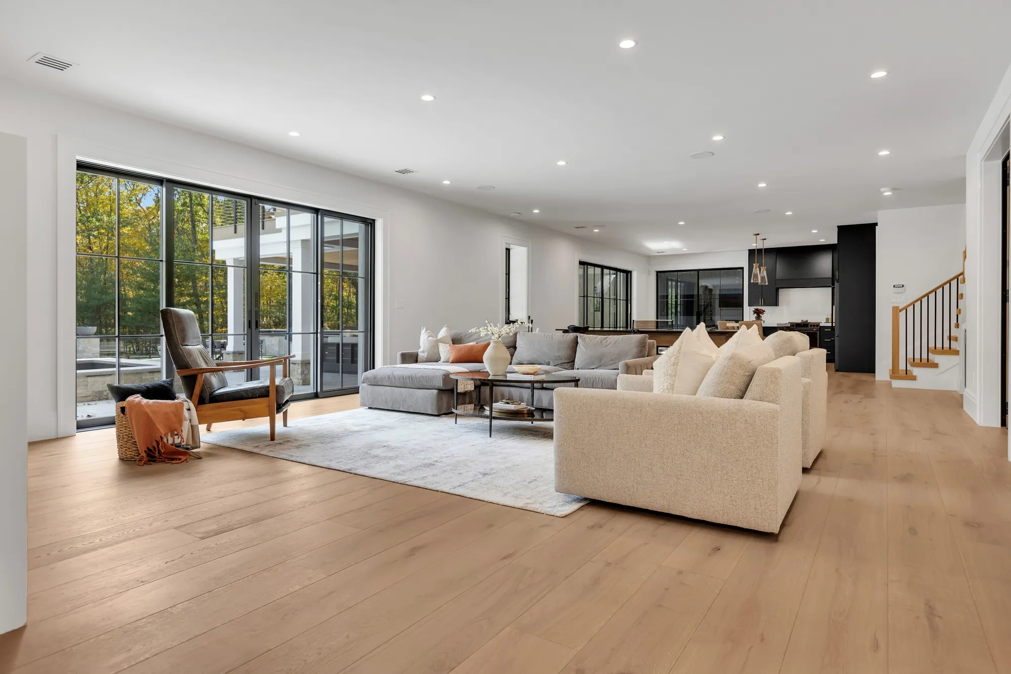 Wide-plank light oak floor in an open living room