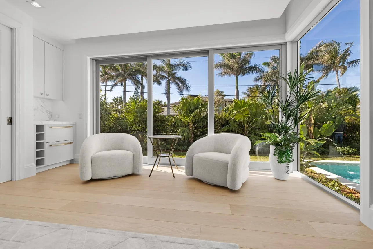 Light oak floor in a sunroom looking out to the garden